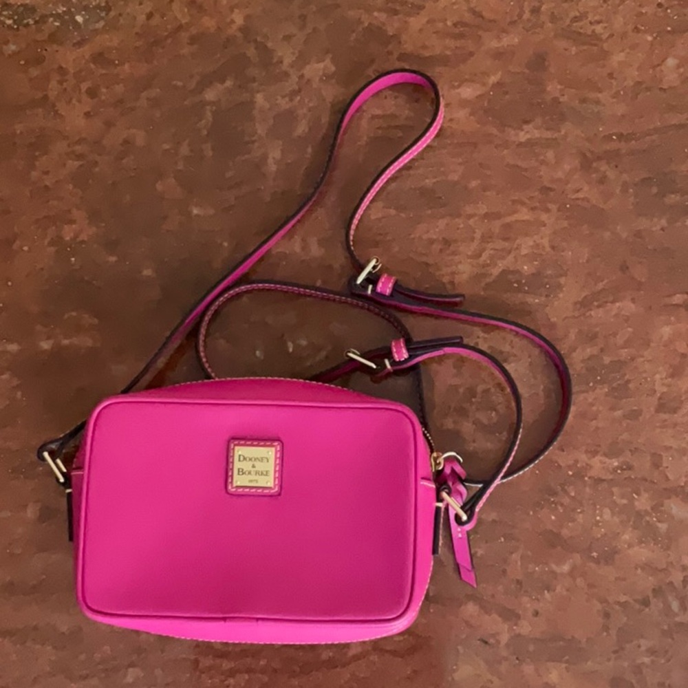 Dooney and Bourke, Italian, leather pink bag. H 5.5” by W 2.5” by H 5.5” New